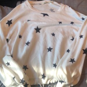 White soft sweater with black stars